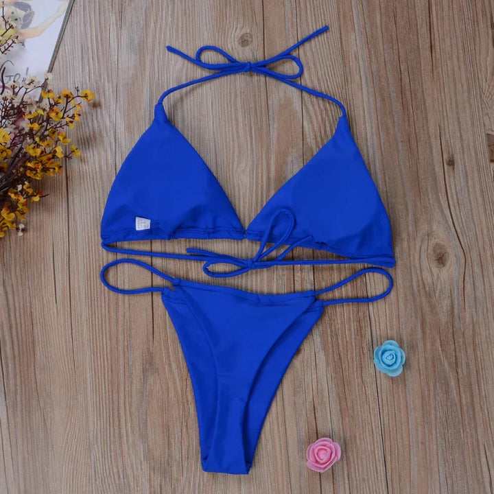 Close-up of a women's side-tie bikini bottom, highlighting the adjustable ties and elegant design details.