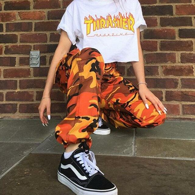 Women's baggy camo cargo pants with ankle cuffs. Stylish streetwear fashion for a casual look.