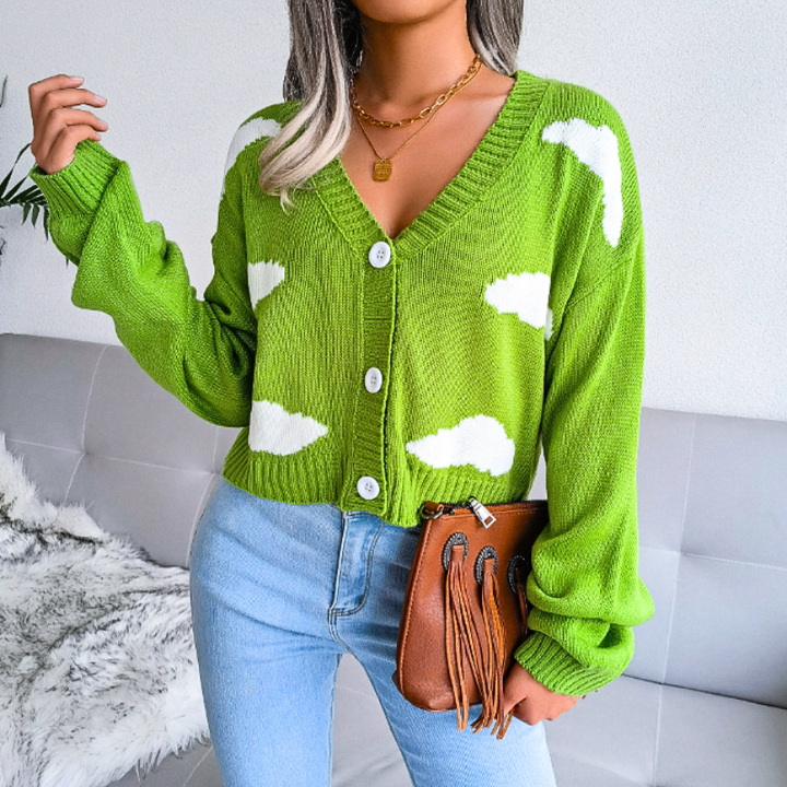 Women's cozy knit cropped cardigan with a dreamy cloud print. V-neck, button-up. Ideal for casual, comfy style.