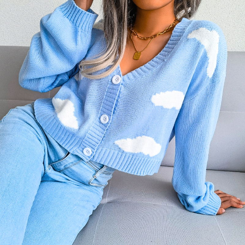 Stylish women's cropped cardigan featuring a dreamy cloud print, V-neck, and button closure. Versatile knitwear.