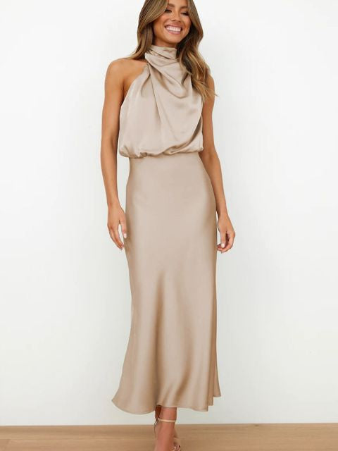 Sophisticated women's halter neck midi dress, an elegant formal evening or cocktail party gown.