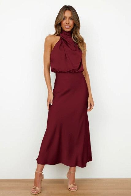 Chic women's midi formal dress with halter neck. Perfect elegant sleeveless cocktail or evening wear.