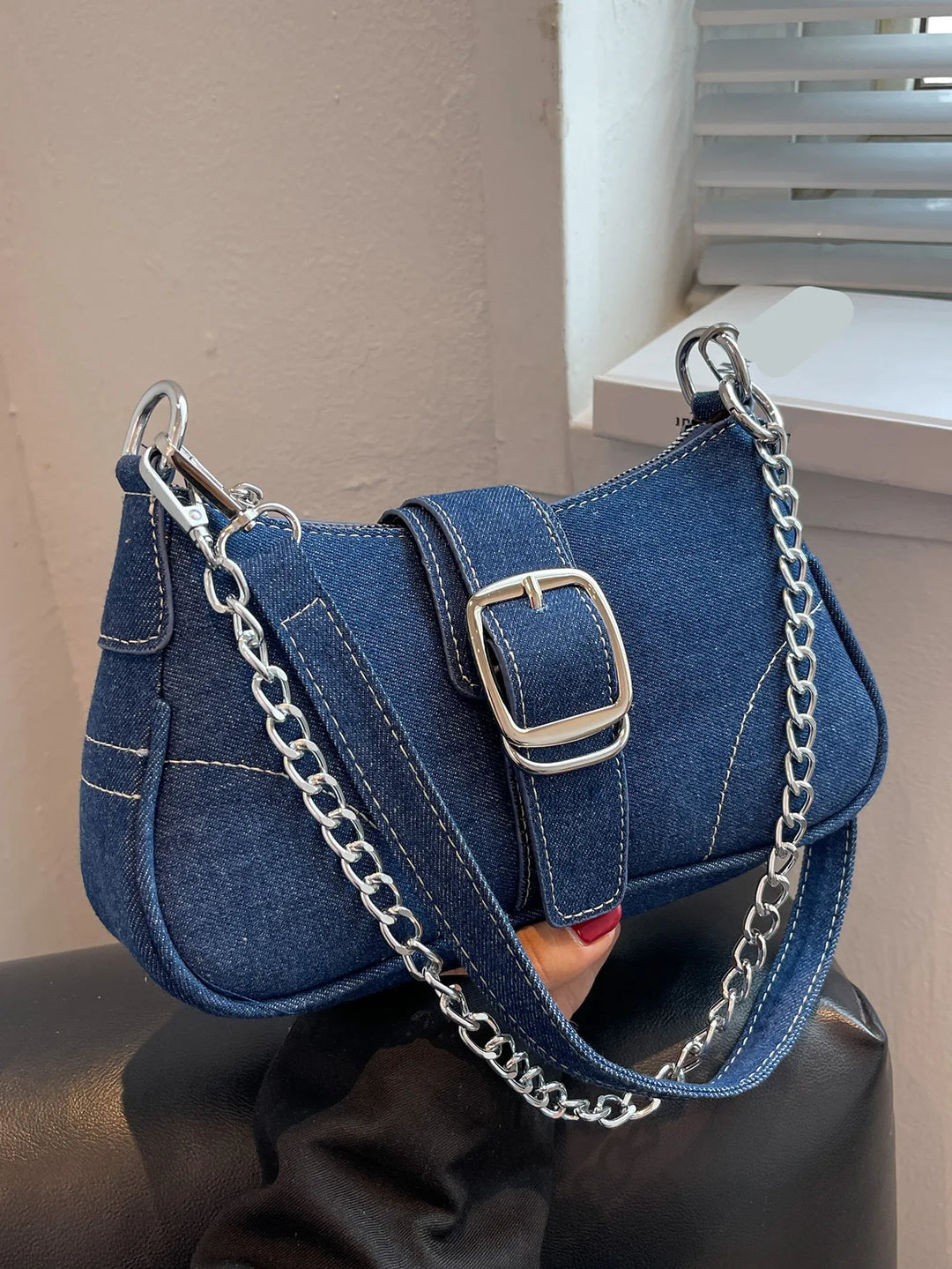 Women's versatile two-way shoulder handbag with stylish buckle accent, perfect for everyday fashion.