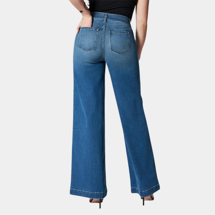 Close-up of women's wide leg jeans featuring a high waist & stretch denim fabric. Stylish and comfortable for modern outfits.
