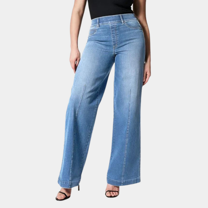 Women's high waisted wide leg jeans in light blue stretch denim. Modern casual style, relaxed fit for everyday comfort.