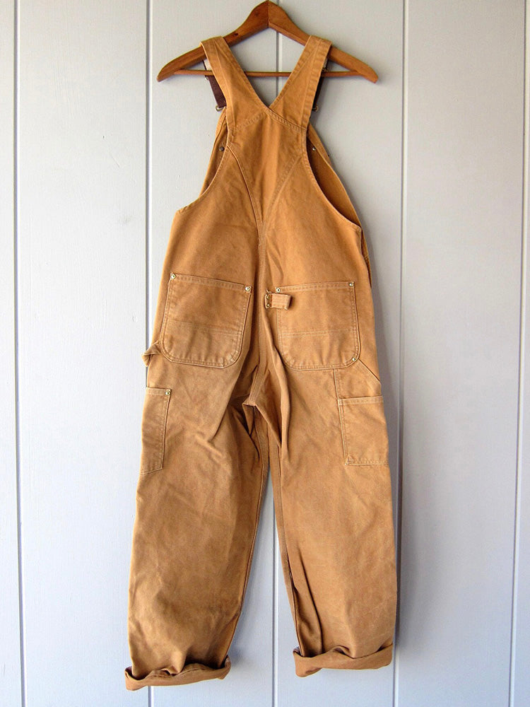 Stylish women's utility dungaree jumpsuit in a soft fabric, offering comfort & a chic casual look.