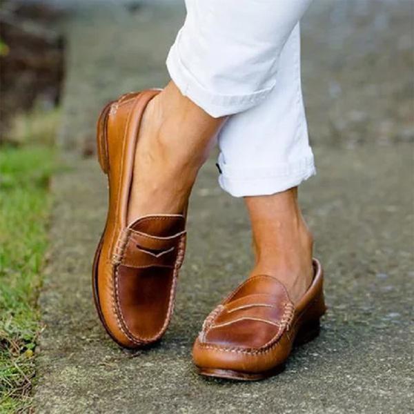 Classic black women's slip-on loafers, perfect for professional work attire or smart casual everyday wear.
