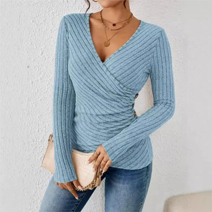 Textured ribbed long sleeve wrap top for women. Flattering V-neck design, perfect for elegant casual wear.