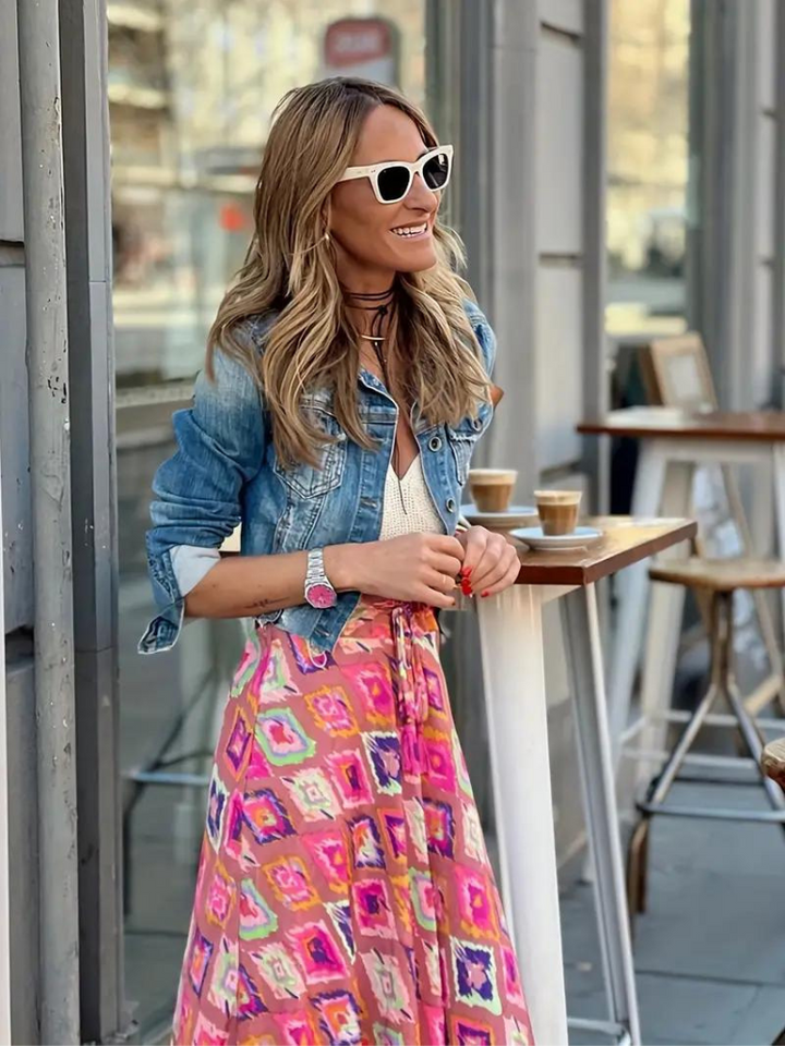 Lightweight women's tiered maxi skirt, offering a comfortable fit and effortless style for sunny summer days.