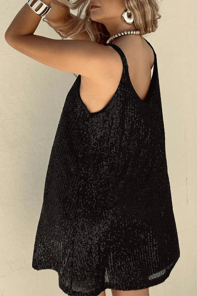 Women's festive sequin V-neck mini dress. Ideal for sparkling parties and chic cocktail events.