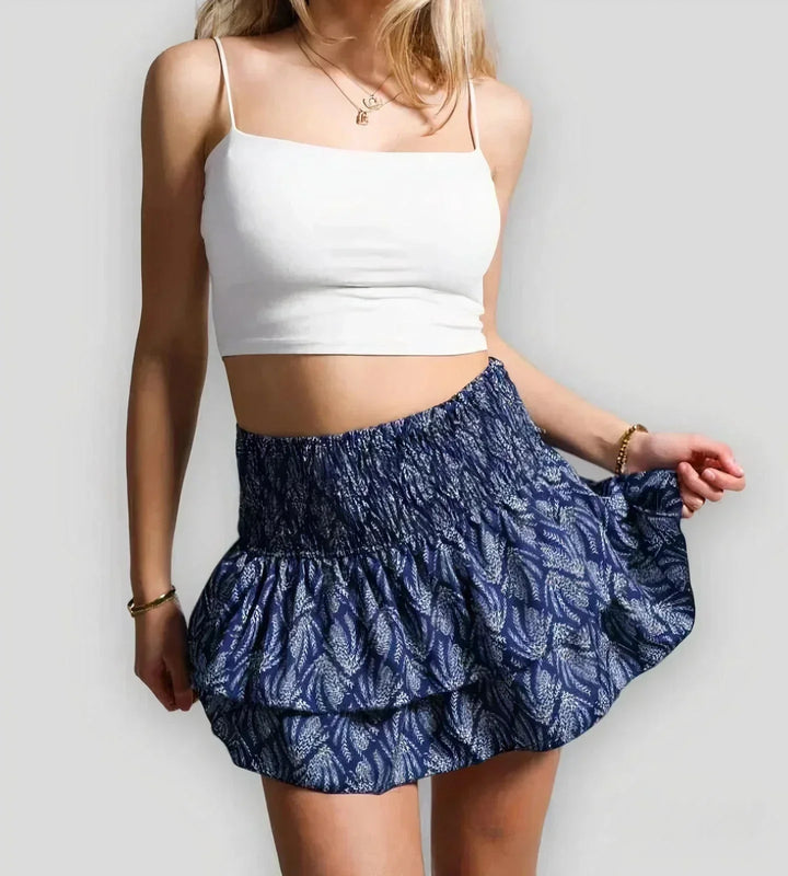 Flattering A-line women's mini skirt with playful layers, great for summer fashion. A flirty, casual women's bottom.