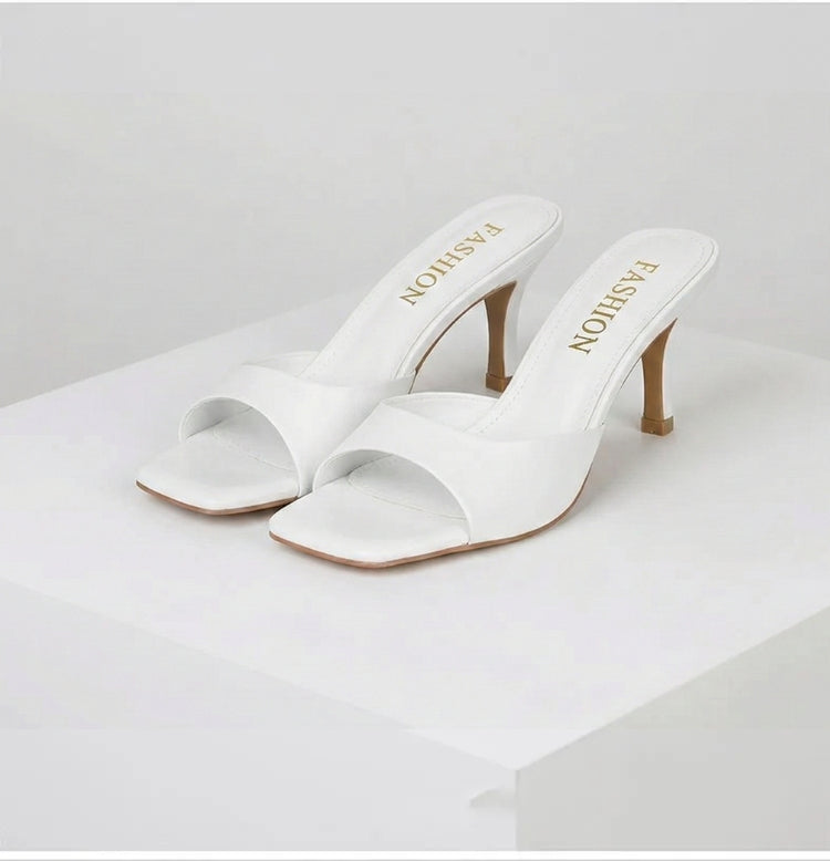 Women's modern open toe mules, slip-on style with an elegant square heel. Comfortable chic shoes.