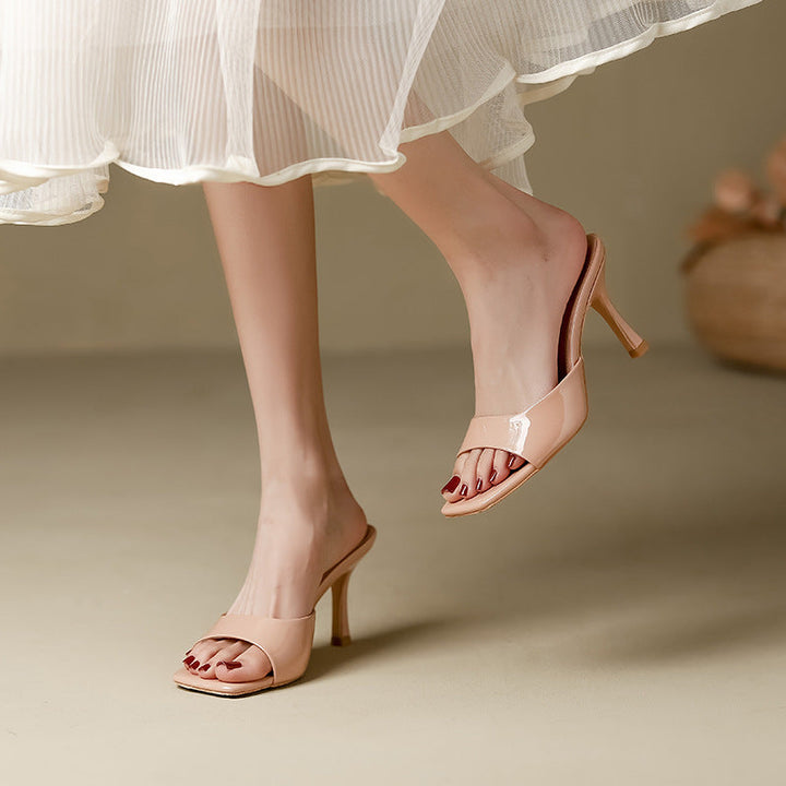 Women's open toe slip-on mules with chic square heel. Stylish & comfortable modern footwear.