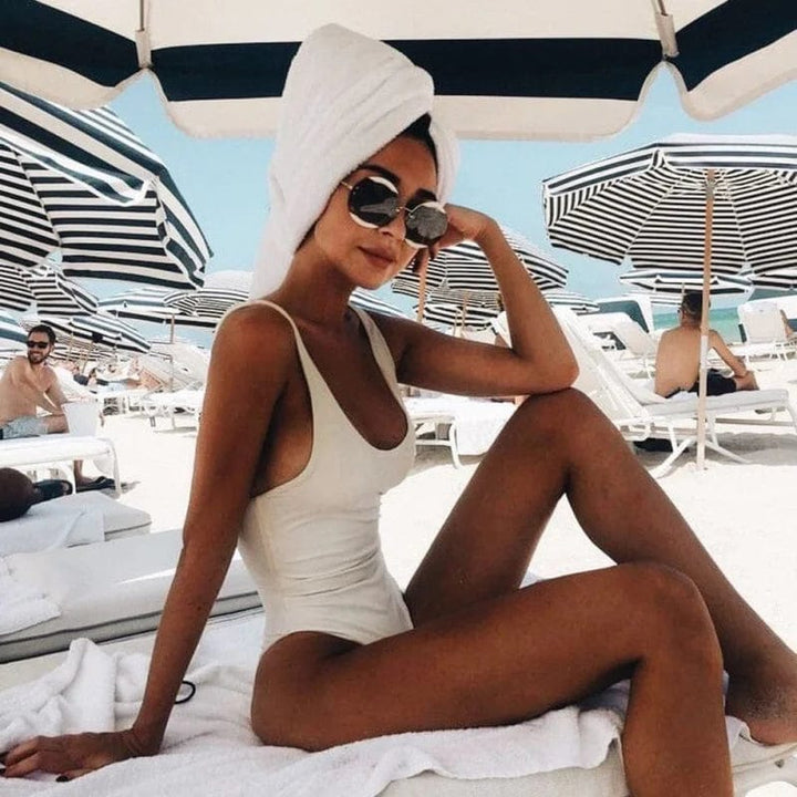 Textured ribbed one-piece high-leg women's swimsuit, quick-dry & stylish for beach fashion.