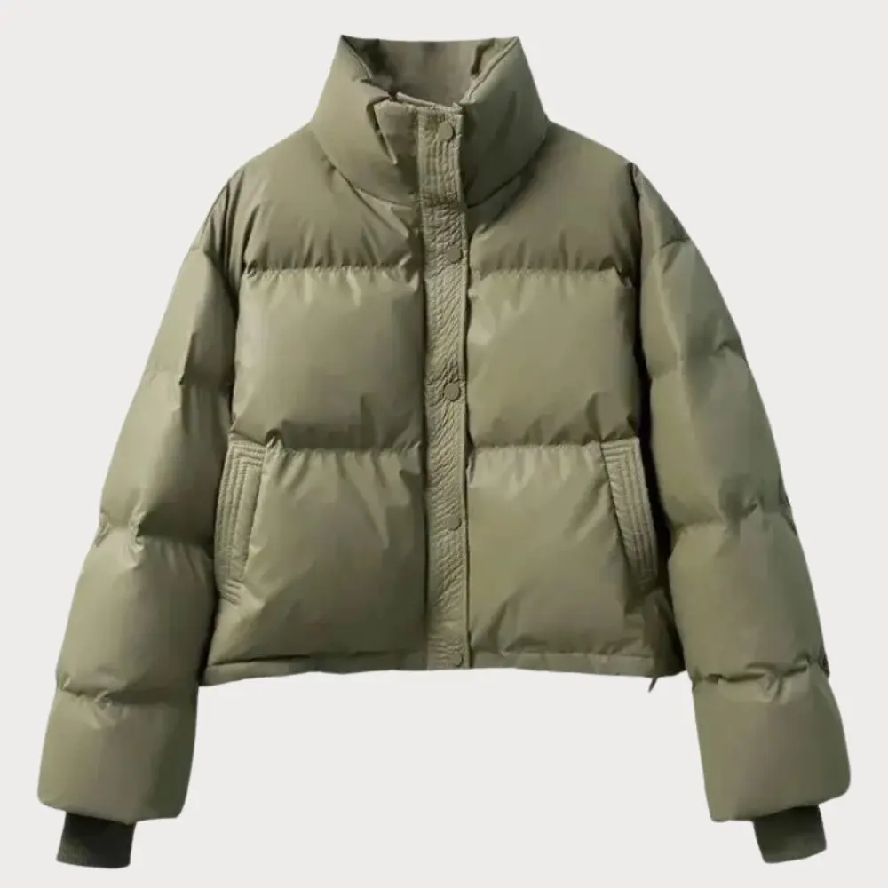 Versatile women's cropped puffer jacket, ideal for casual wear, featuring a comfy stand collar & snap closure.