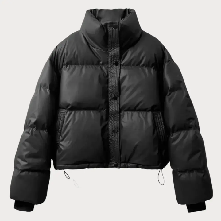 Women's cropped puffer jacket with stand collar & snap closure for stylish cold weather fashion.