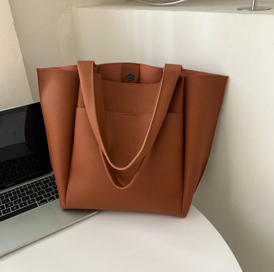 Chic women's large shoulder tote, an elegant fashion accessory. Structured design for work & everyday style.