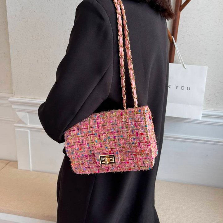 Versatile structured shoulder bag for women, convertible to crossbody with a chic chain strap.