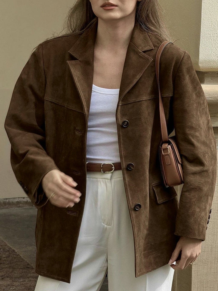 Women's chic oversized suede jacket with button-front closure, perfect for casual layering and effortless style.
