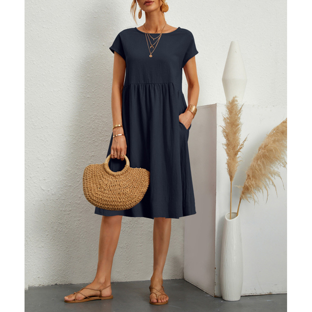 Detail shot of the soft fabric & round neck on a versatile women's casual summer midi dress.