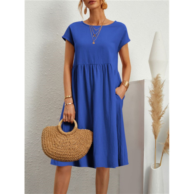 Back view of a fashionable women's midi dress, showcasing its versatile design for summer outings.