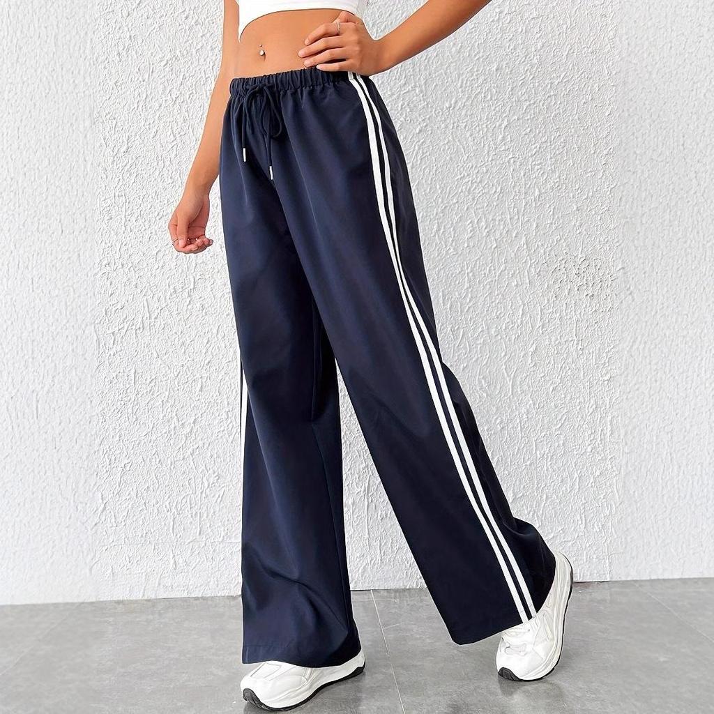 Ladies' wide leg casual pants, palazzo fit, with a modern side stripe detail. Ideal for relaxed everyday style.