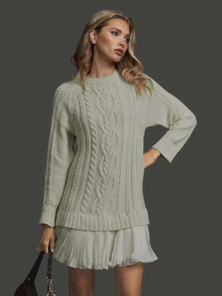 Versatile women's cable knit winter dress, elegant and casual, with long sleeves and pleated detail.