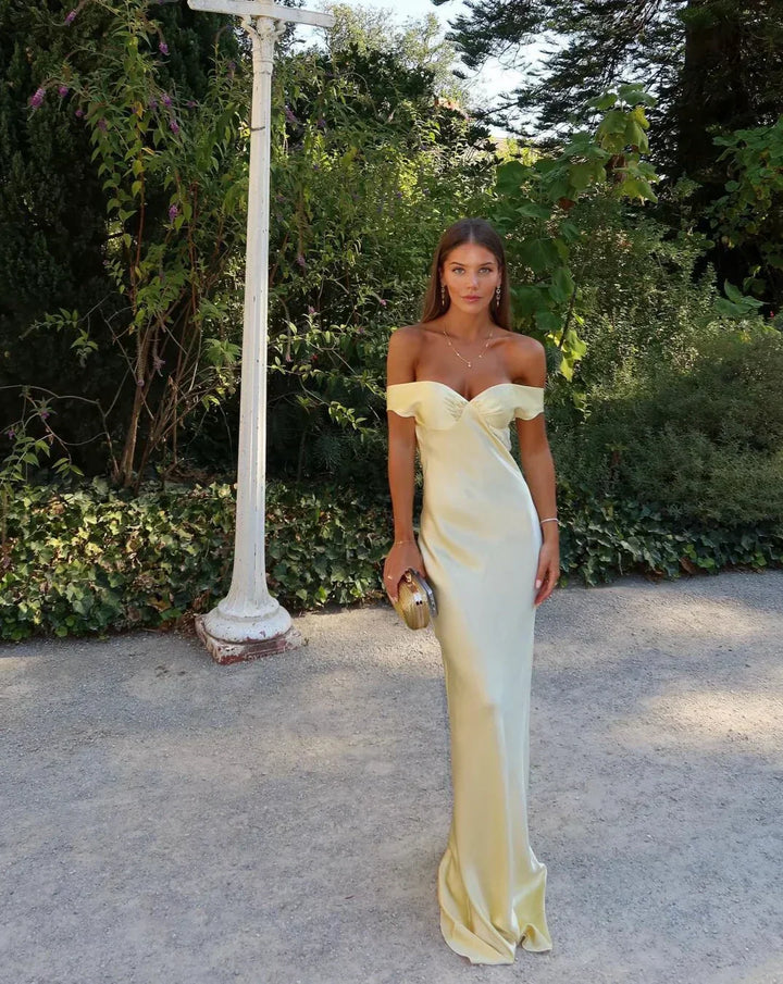 Elegant women's long yellow formal gown, a stunning maxi dress for special occasion wear.
