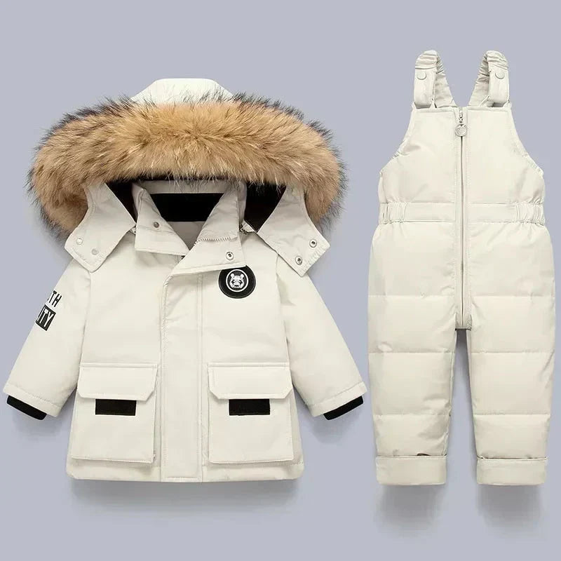Toddler winter jacket and snow pants set. Fashionable, warm outerwear for cold weather activities.