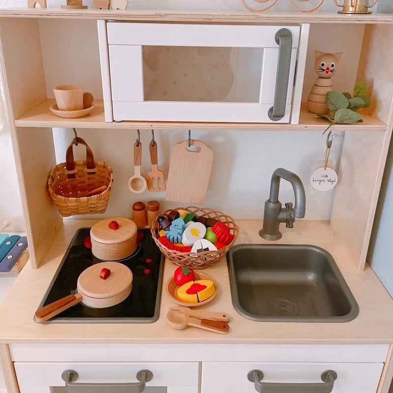Educational wooden play kitchen toy, encouraging role play and skill development for toddlers and young children.