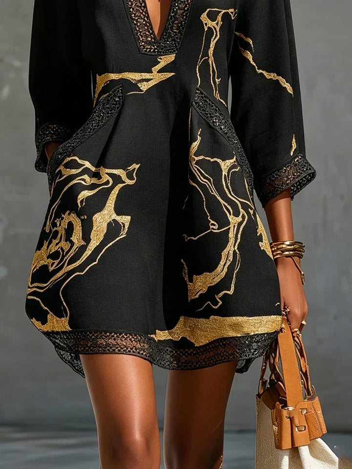 Comfortable women's printed mini tunic dress featuring a v-neck and 3/4 sleeves, ideal for summer.