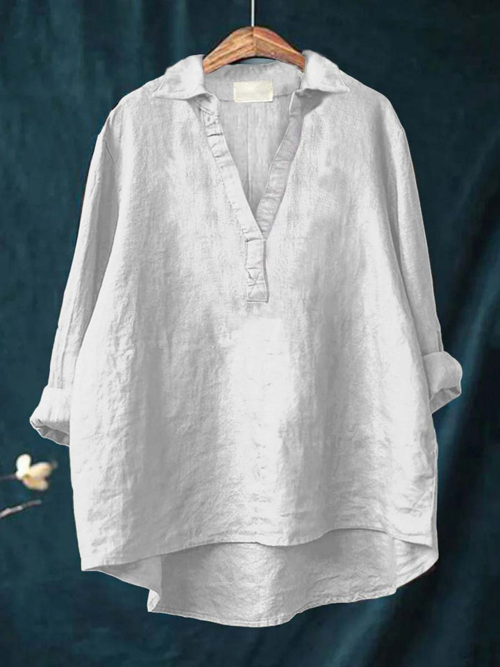 Classic women's long-sleeve blouse, button-down elegant top perfect for versatile office and casual outfits.