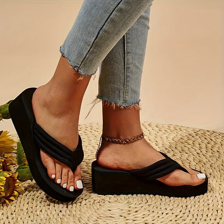Open-toe women's summer slippers with ergonomic design and comfortable arch support for all-day wear.