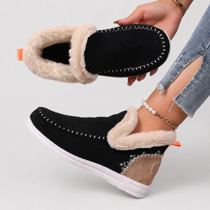 Women's cozy orthopedic house slippers paired with loungewear. Warm, supportive indoor footwear for comfort.