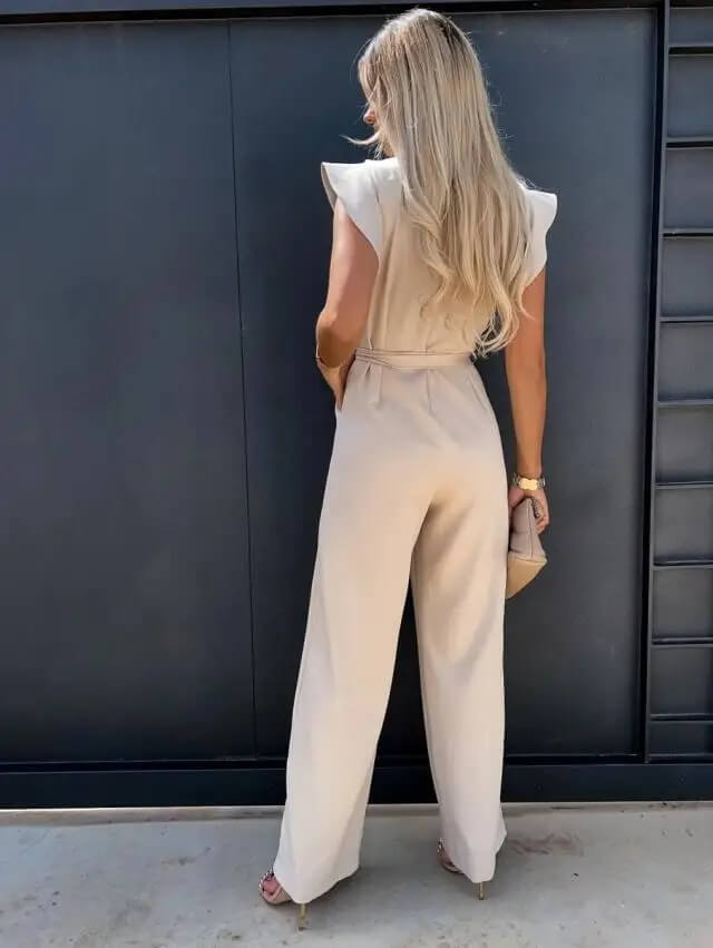 Beige women's wide-leg jumpsuit with ruffle sleeves & a belted waist. Chic and versatile summer fashion.