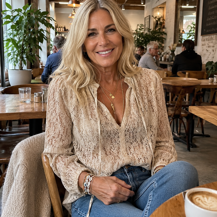 Flowy women's boho lace V-neck blouse with a relaxed fit, offering comfortable and stylish summer wear. Casual elegance.