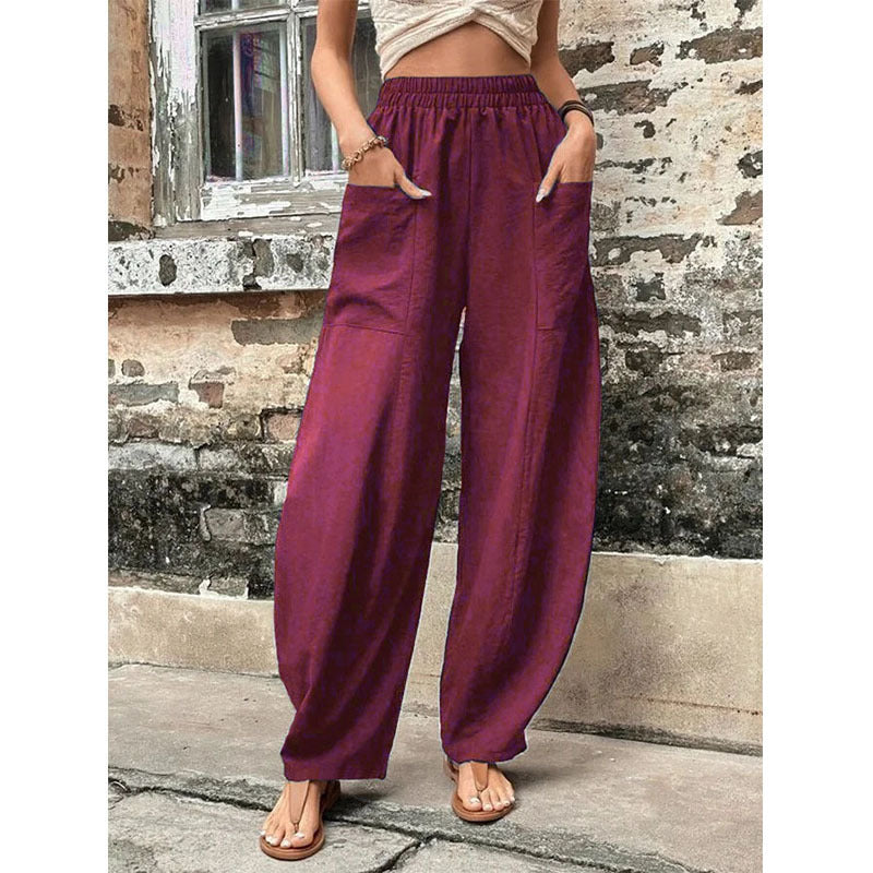 Comfortable women's palazzo trousers featuring spacious wide legs and essential side pockets.
