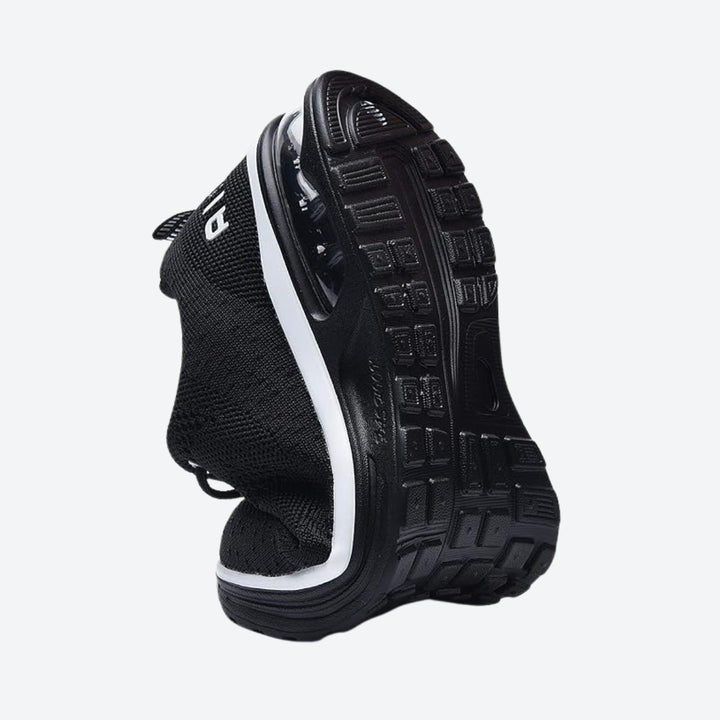 Side view of women's black air cushion sneakers, designed for walking comfort.