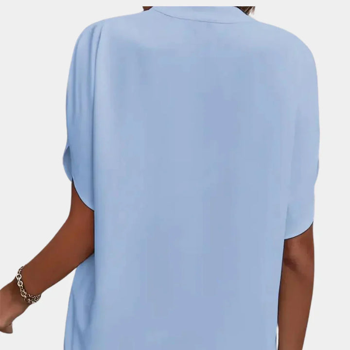 Women's loose-fit airy blouse, summer top for effortless casual wear in warm weather.