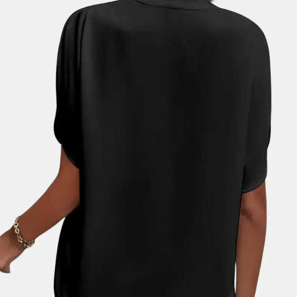 Airy short-sleeve summer blouse for women, loose fit & casual wear.
