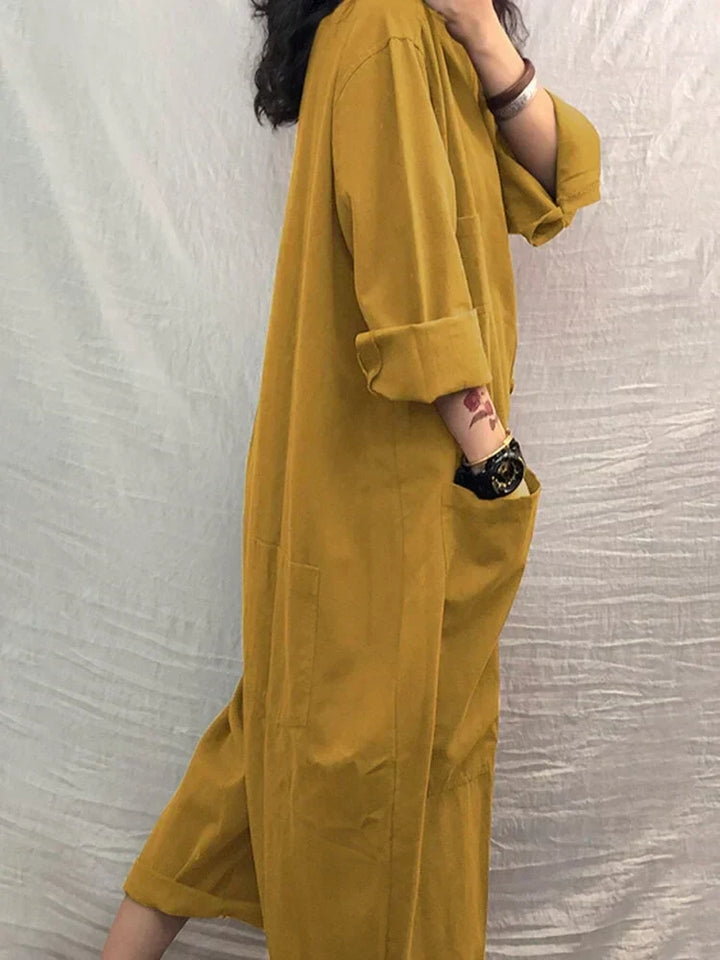 Effortless women's wide-leg jumpsuit, ideal for summer casual wear & comfortable travel. Features pockets and V-neck.
