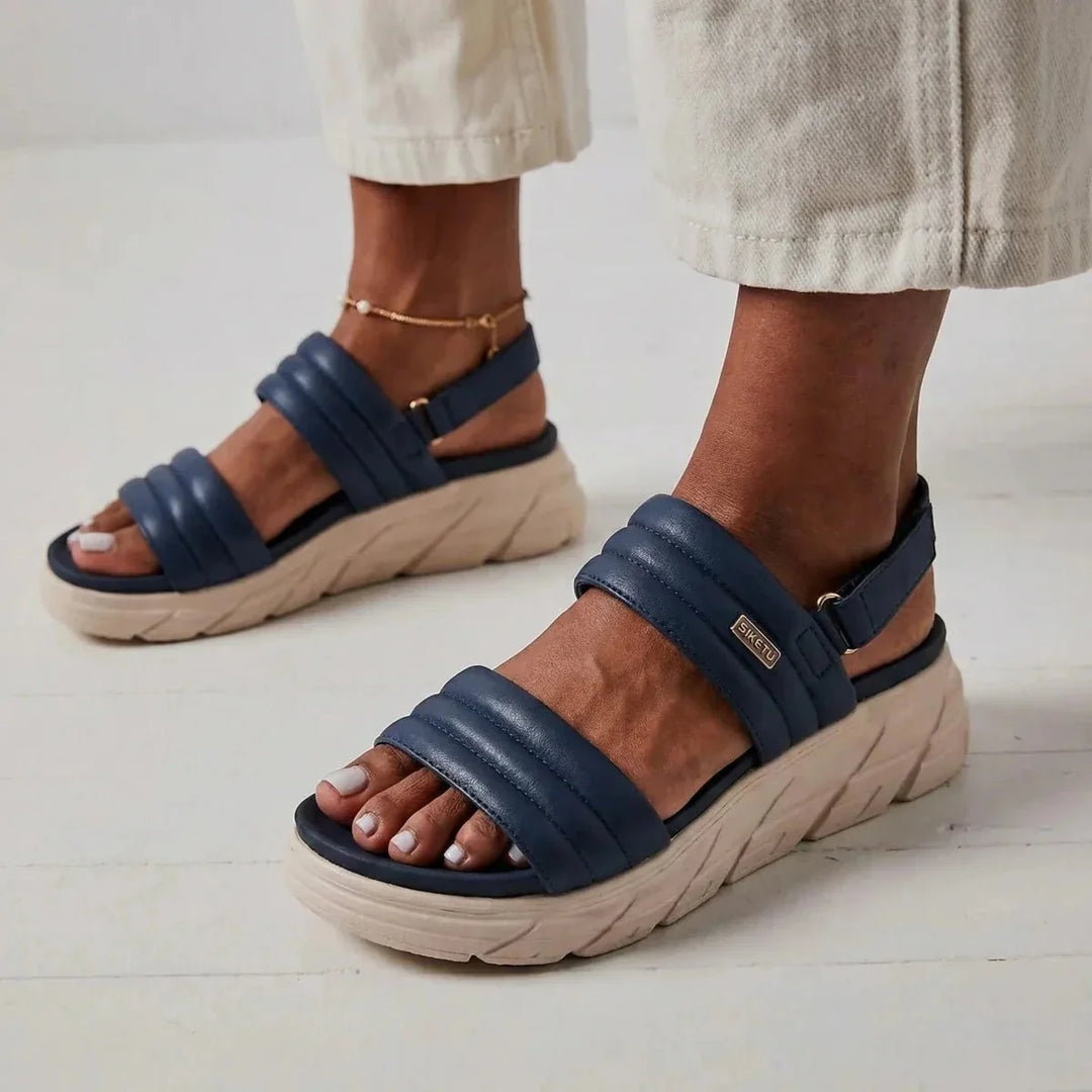 Stylish women's slip-on sandals, offering excellent arch support for all-day comfort.