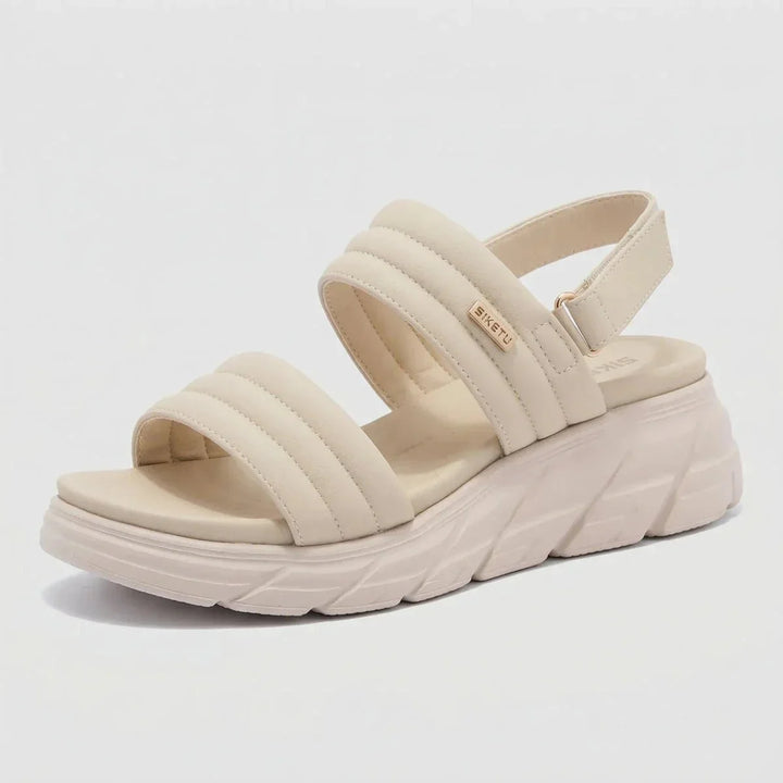Slip-on women's walking sandals, offering relief from foot pain with arch support.