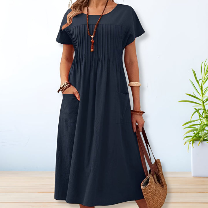 Orange casual short sleeve crew neck midi dress. Relaxed fit, ideal comfortable summer dress for women.