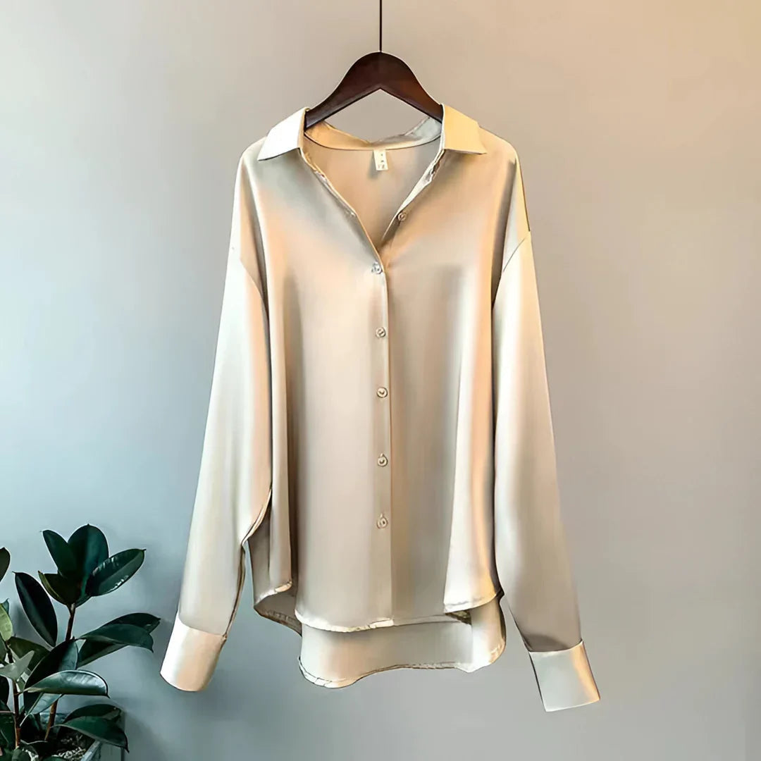 Elegant women's flowy button-up blouse with long sleeves, perfect for office wear or chic fashion.