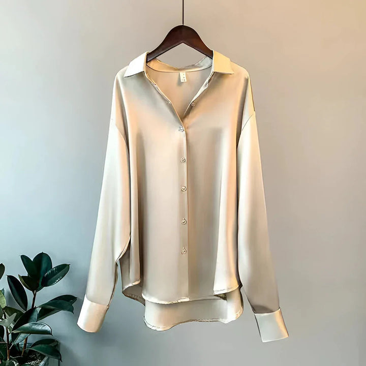 Elegant women's flowy button-up blouse with long sleeves, perfect for office wear or chic fashion.