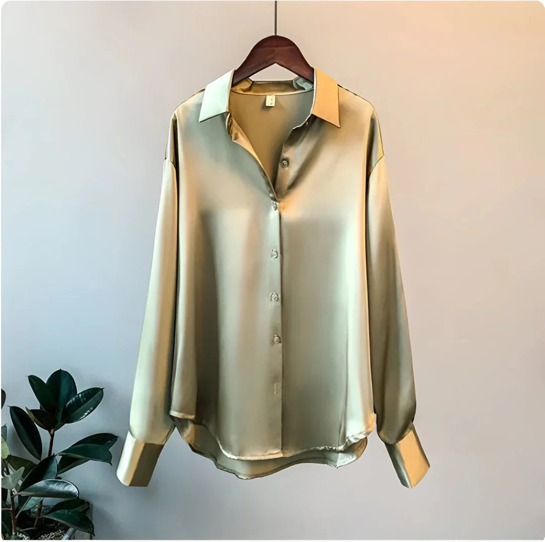 Women's elegant flowy long-sleeve blouse in a button-up design, styled for a sophisticated office look.