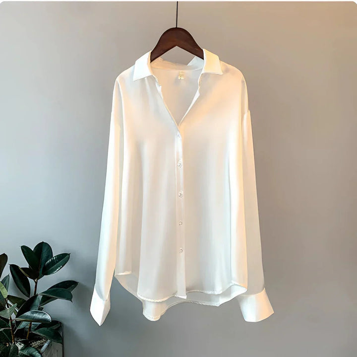 Women's long-sleeve button-up blouse; an elegant, flowy and versatile fashion top for chic office wear.