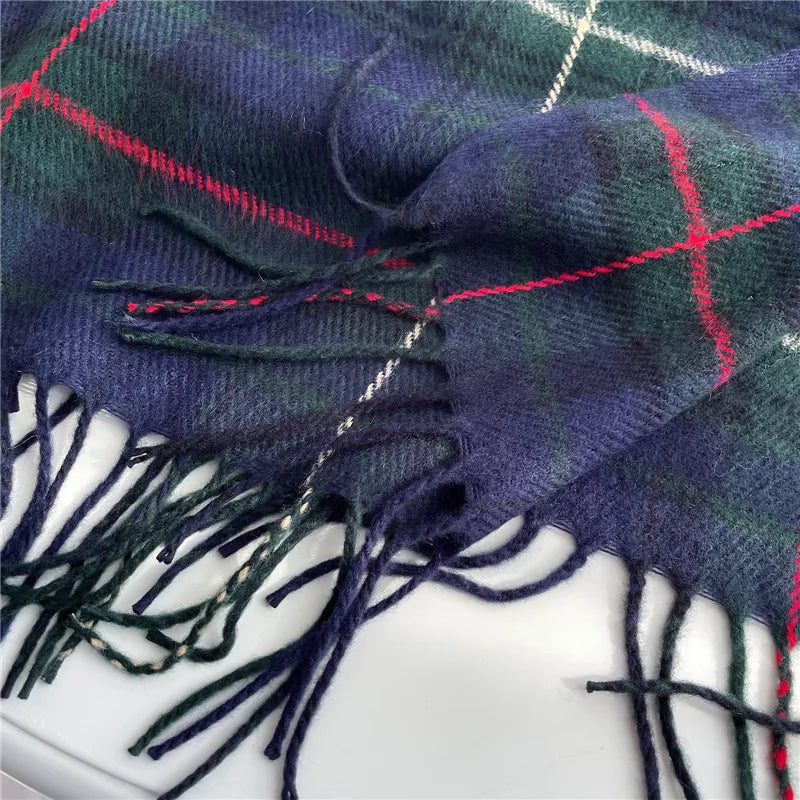 Women's stylish fashion accessory: a warm, checkered knitted scarf adorned with elegant tassels.