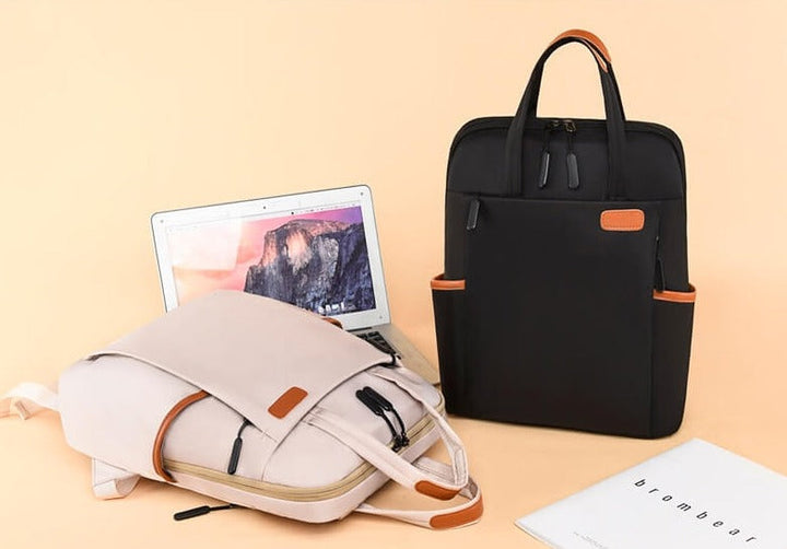 Black anti-theft women's travel daypack, water-resistant material, lightweight and ideal for city exploration.